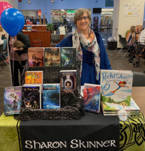 Sharon standing behind book display.