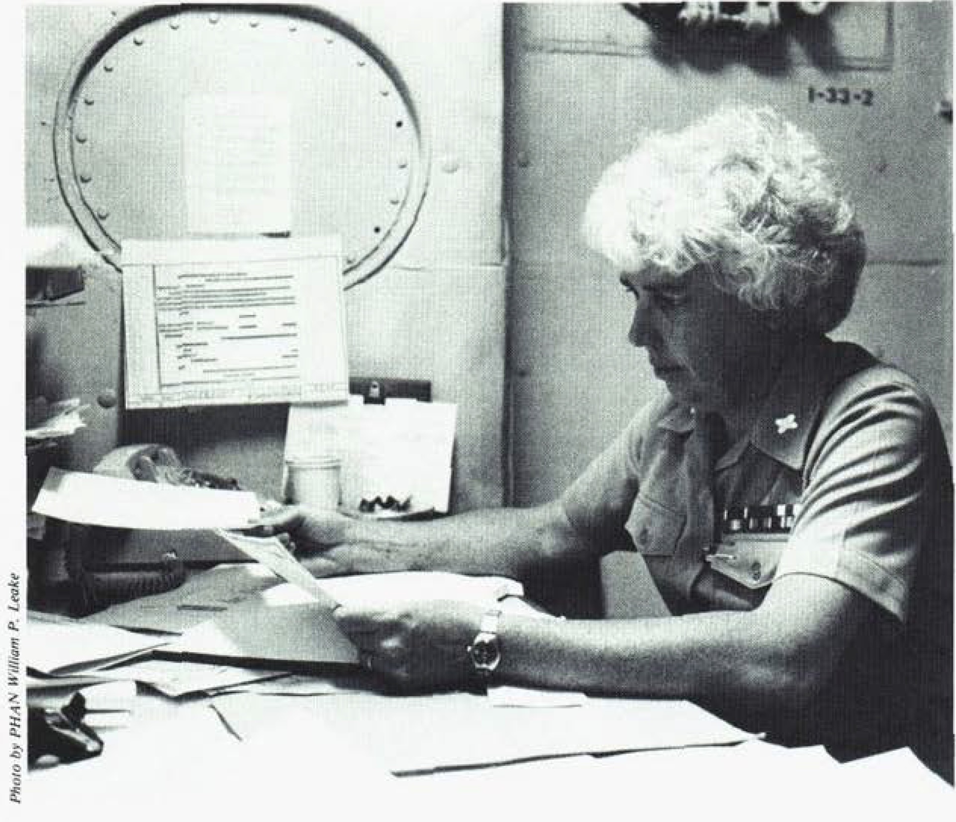 CW (Chief Warrant Officer) 02 Wilson at her desk aboard the USS Jason.
