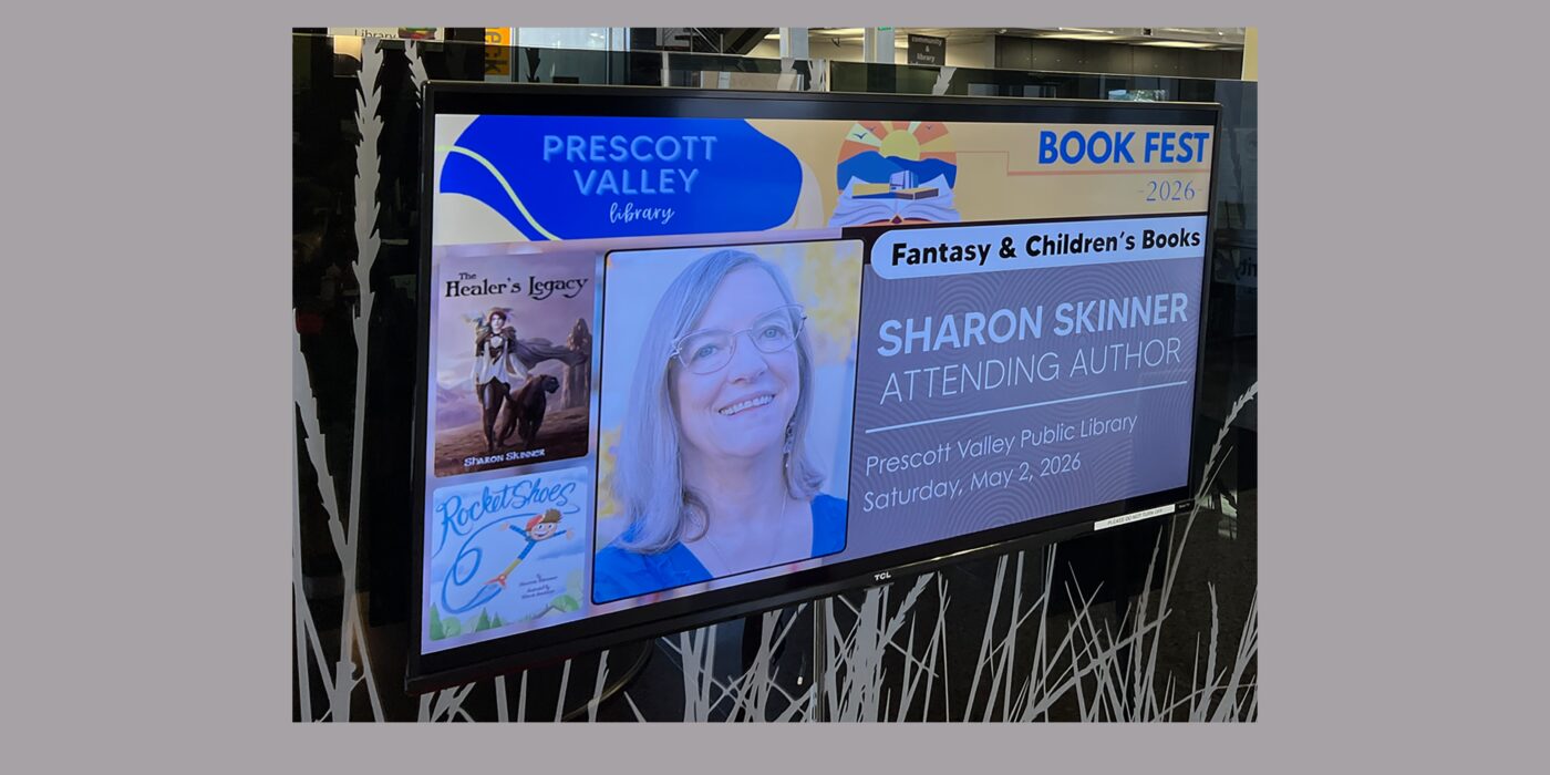 photo of Prescott Valley Public Library Book Festival digital billboard with Sharon's head shot and some of her book covers
